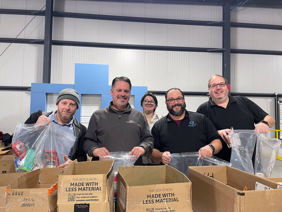 SSC IT team members packing boxes with goods